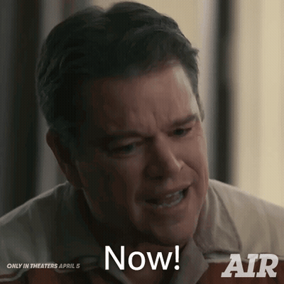 A Man Says " Now " In Front Of A Sign That Says Air GIF