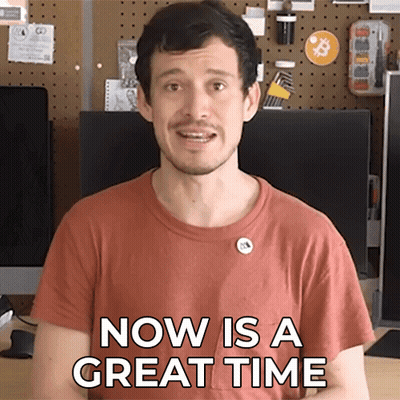 A Man Says Now Is A Great Time In Front Of A Computer Monitor GIF