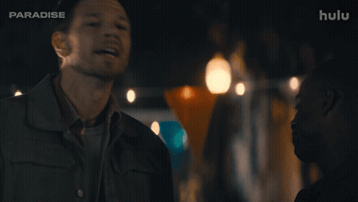 A Man Says " Nunya Business " In Front Of A Hulu Logo GIF