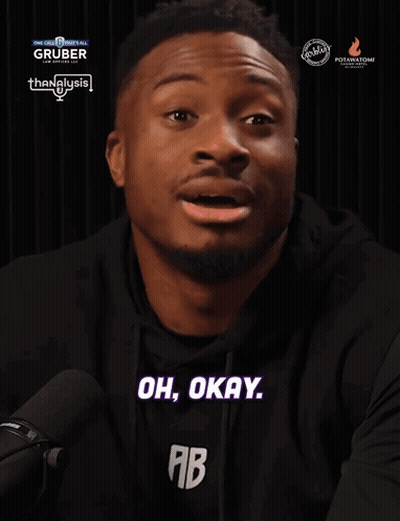 A Man Says Oh Okay In Front Of A Gruber Advertisement GIF