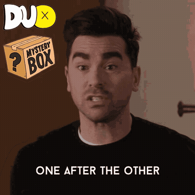 A Man Says One After The Other Next To A Box That Says Mystery Box GIF
