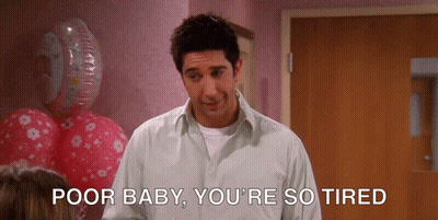 A Man Says Poor Baby You 'Re So Tired While Standing In Front Of Balloons GIF