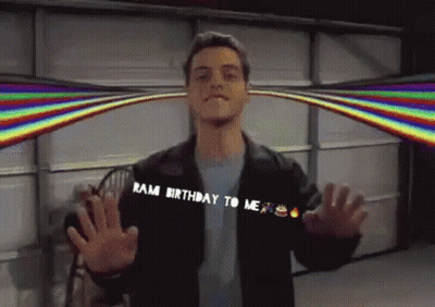 A Man Says Ram Birthday To Me With A Rainbow In The Background GIF