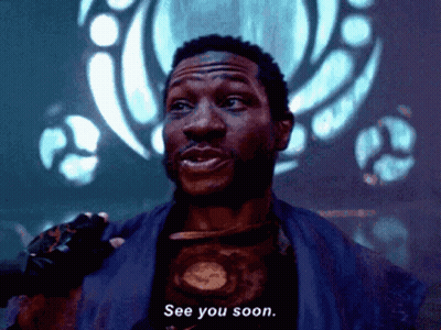 A Man Says See You Soon In Front Of A Blue Background GIF