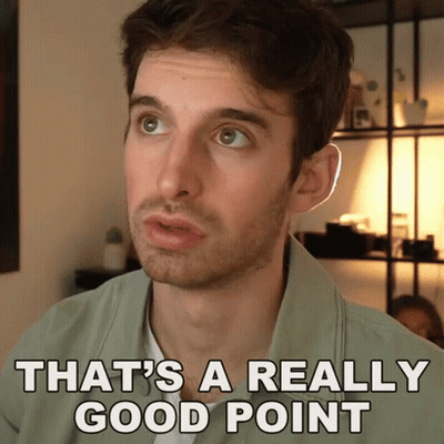 A Man Says That 'S A Really Good Point In Front Of A Shelf GIF