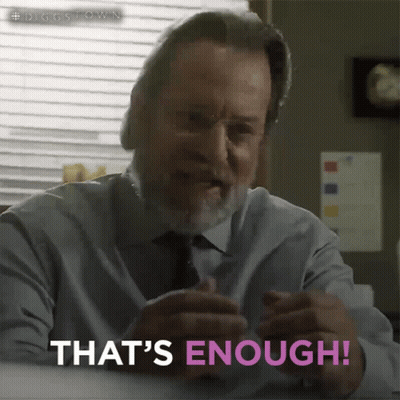 A Man Says That 'S Enough While Sitting At A Table GIF