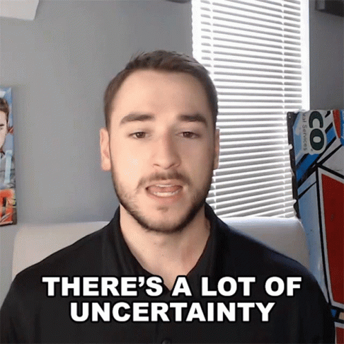 A Man Says " There 'S A Lot Of Uncertainty " In Front Of A Window GIF