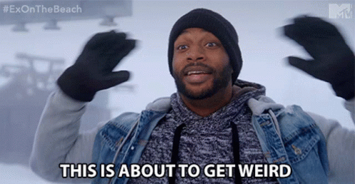 A Man Says This Is About To Get Weird While Wearing Gloves And A Beanie GIF