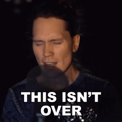 A Man Says This Isn 'T Over In A Dark Room GIF