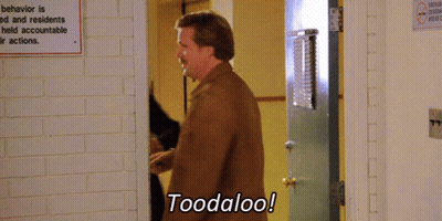 A Man Says Toodaloo In Front Of A Sign That Says Behavior Is Ed And Residents Held Accountable Their Actions GIF