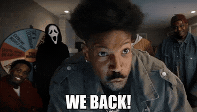 A Man Says We Back In Front Of A Group Of People GIF