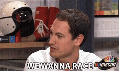 A Man Says We Wanna Race In Front Of Nascar Helmets GIF