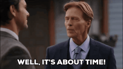 A Man Says Well It 'S About Time While Talking To Another Man GIF