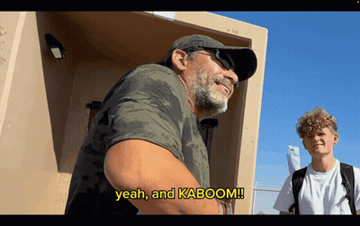 A Man Says Yeah And Kaboom While Standing Next To Another Man GIF