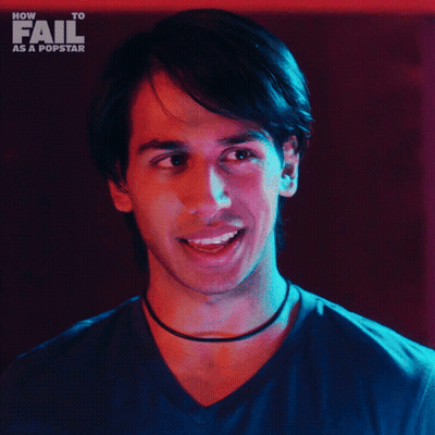 A Man Says Yeah It 'S Fun In Front Of A How To Fail As A Popstar Logo GIF