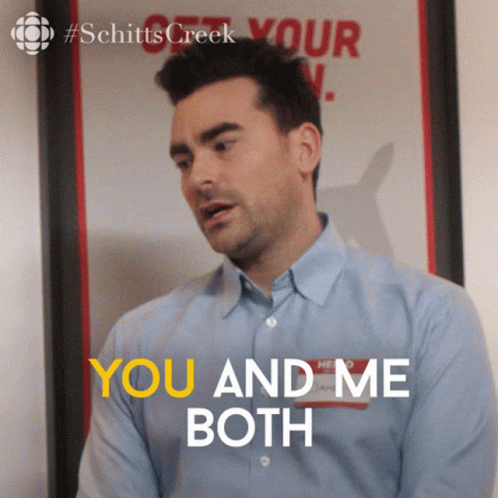 A Man Says You And Me Both In Front Of A Poster GIF
