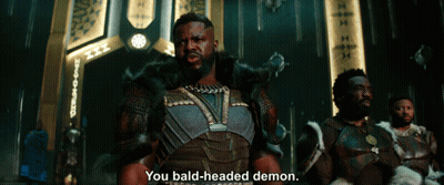 A Man Says You Bald-Headed Demon In Front Of A Group Of Men GIF