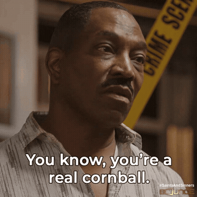 A Man Says You Know You 'Re A Real Cornball In Front Of A Crime Scene Tape GIF