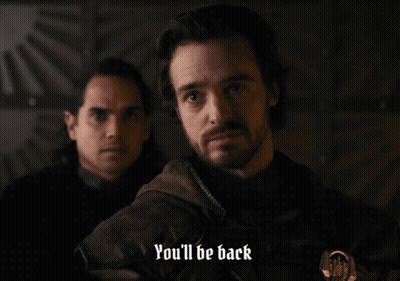 A Man Says " You 'Ll Be Back " While Another Man Looks On GIF