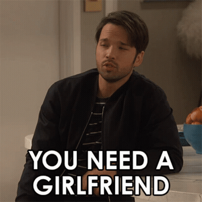 A Man Says You Need A Girlfriend While Sitting At A Counter GIF