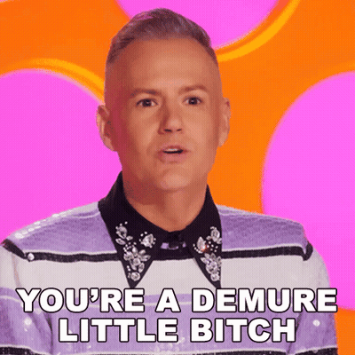 A Man Says You 'Re A Demure Little Bitch On A Pink Background GIF