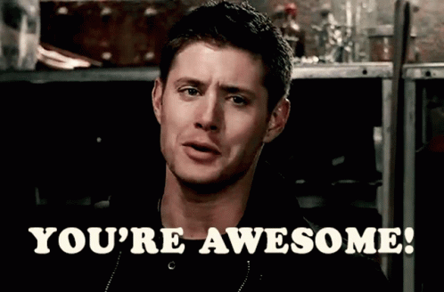 A Man Says " You 'Re Awesome " In Front Of A Dark Background GIF