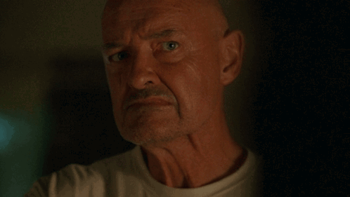 A Man Says " You 'Re Not Welcome Here Anymore " In A Dark Room GIF