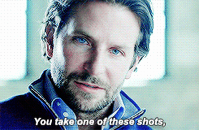 A Man Says " You Take One Of These Shots " While Looking At The Camera GIF