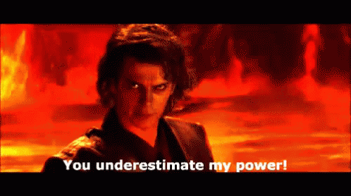 A Man Says You Underestimate My Power In Front Of A Fire Background GIF