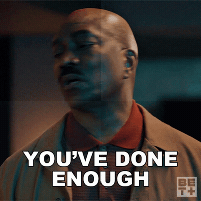 A Man Says " You 'Ve Done Enough " In Front Of A Dark Background GIF
