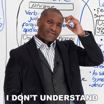 A Man Scratches His Head In Front Of A White Board With Phrases Written On It GIF