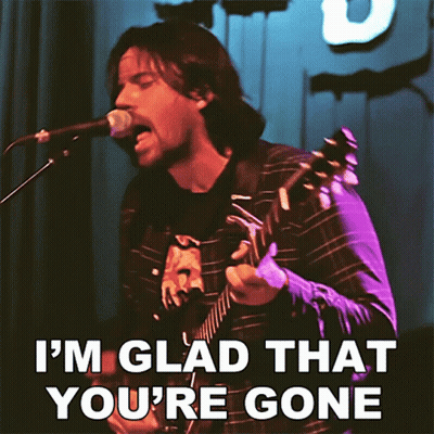 A Man Singing Into A Microphone And Playing A Guitar With The Words I 'M Glad That You 'Re Gone GIF