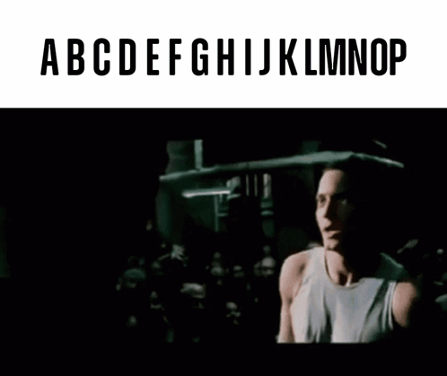 Man Singing Into Microphone With ABCDEFGHIJKLMNOP GIF
