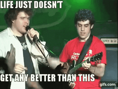 A Man Singing Into A Microphone Next To A Man Playing A Guitar With The Caption Life Just Doesn 'T GIF