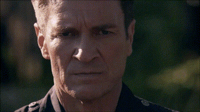 A Man Singing Into A Microphone With A Beard GIF