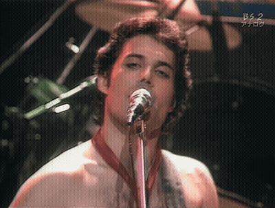 A Man Singing Into A Microphone With Bs 2 Written On The Bottom Right GIF
