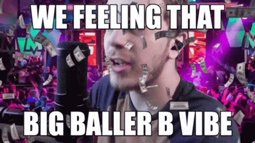 A Man Singing Into A Microphone With Money Falling On His Face And The Words We Feeling That Big Baller B Vibe Below Him GIF