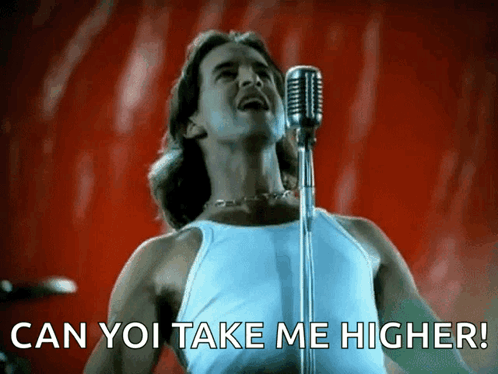 A Man Singing Into A Microphone With The Caption Can You Take Me Higher GIF