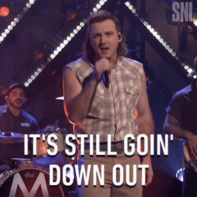 A Man Singing Into A Microphone With The Caption It 'S Still Goin ' Down Out GIF