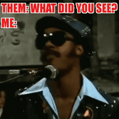 A Man Singing Into A Microphone With The Caption " Them What Did You See " GIF
