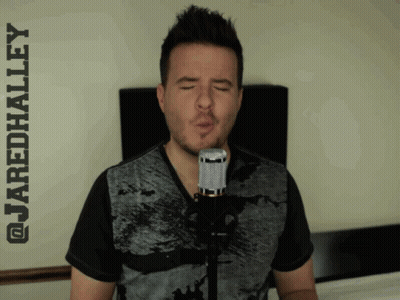 A Man Singing Into A Microphone With The Name Jaredhalley Written Above Him GIF