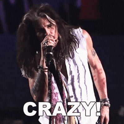 A Man Singing Into A Microphone With The Word Crazy Written Below Him GIF