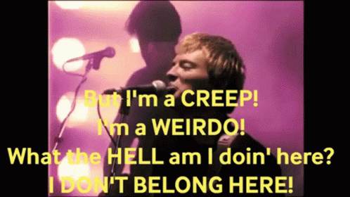 A Man Singing Into A Microphone With The Words But I 'M A Creep In Yellow GIF