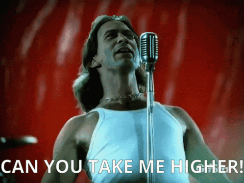 A Man Singing Into A Microphone With The Words " Can You Take Me Higher " Below Him GIF