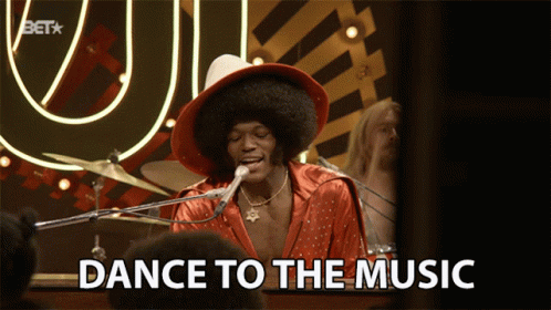 A Man Singing Into A Microphone With The Words Dance To The Music GIF