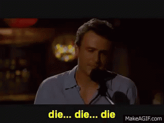 A Man Singing Into A Microphone With The Words Die Die Die Written Below Him GIF