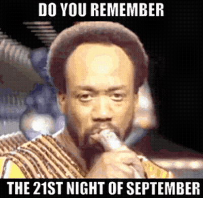 A Man Singing Into A Microphone With The Words " Do You Remember The 21St Night Of September " Below Him GIF
