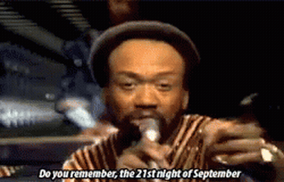 A Man Singing Into A Microphone With The Words Do You Remember The 21St Night Of September GIF