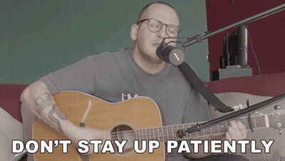 A Man Singing Into A Microphone With The Words " Don T Stay Up Patiently " Below Him GIF