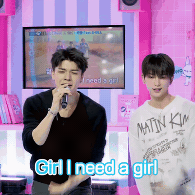 A Man Singing Into A Microphone With The Words Girl I Need A Girl Written Below Him GIF